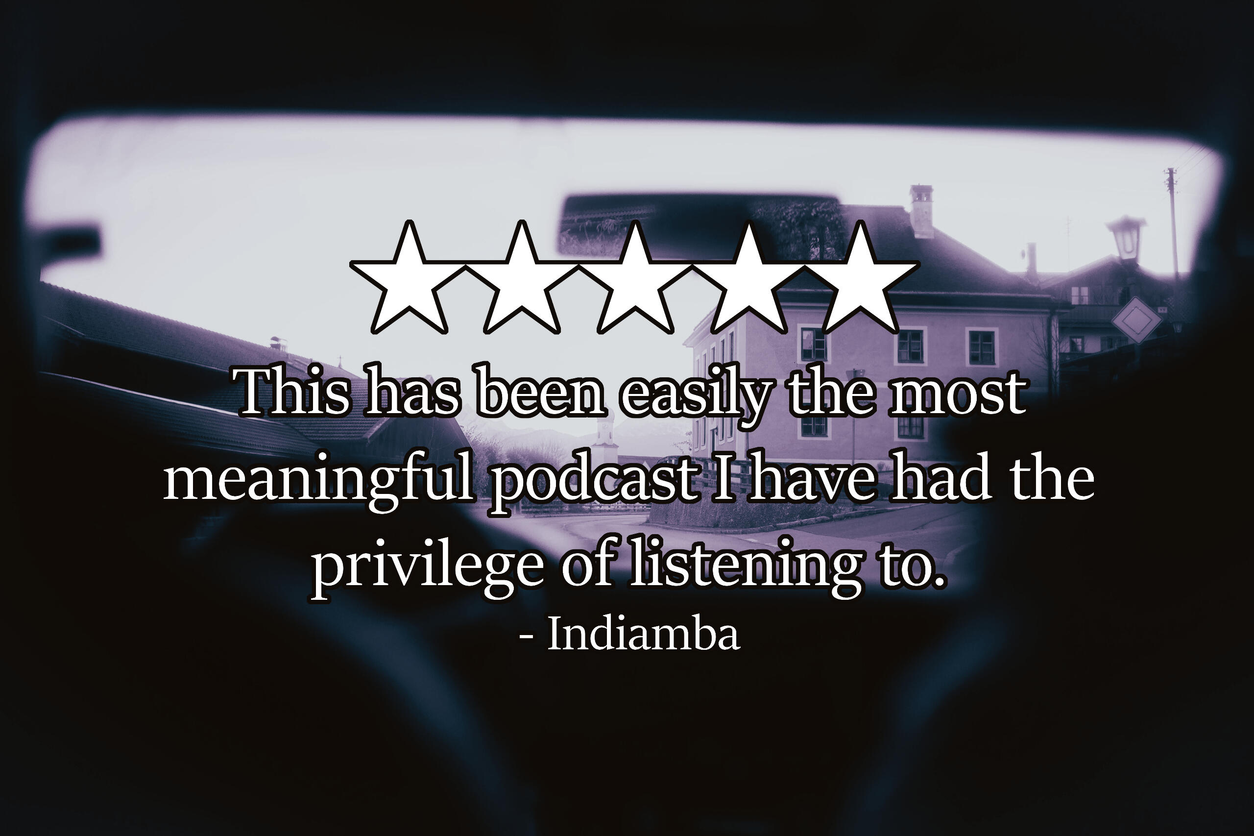 A photo through the windshield of a car of a house and street beyond